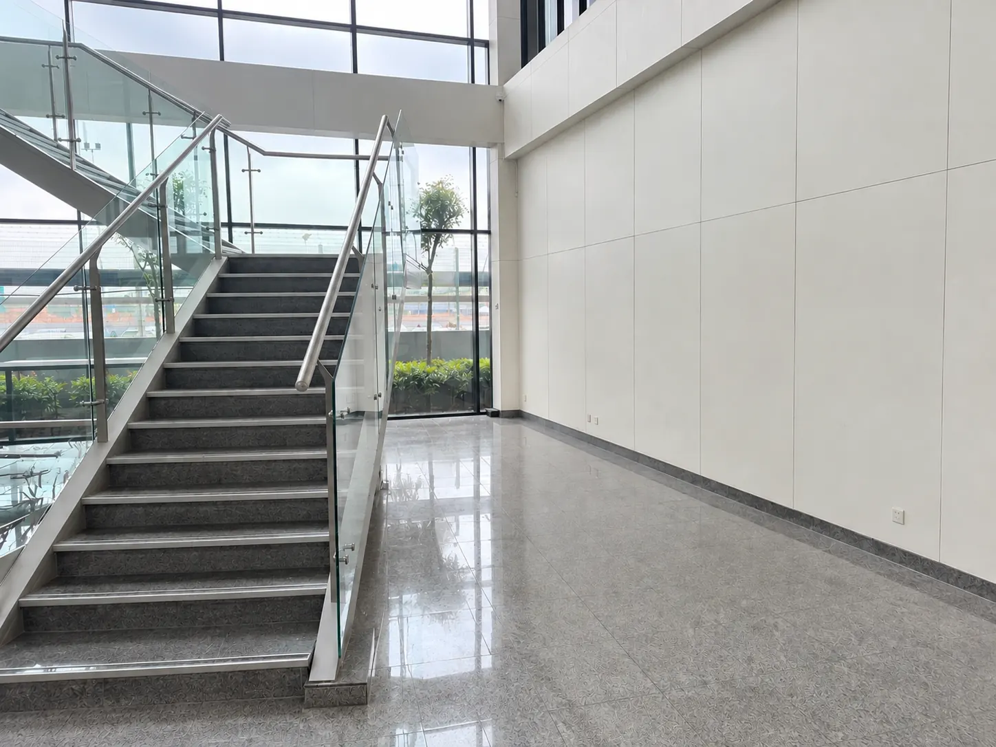 Before: the empty Princeton Digital Group lobby with bare walls and no furniture