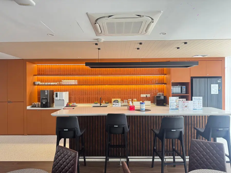 Custom pantry carpentry with LED-lit open shelving and tall cabinets