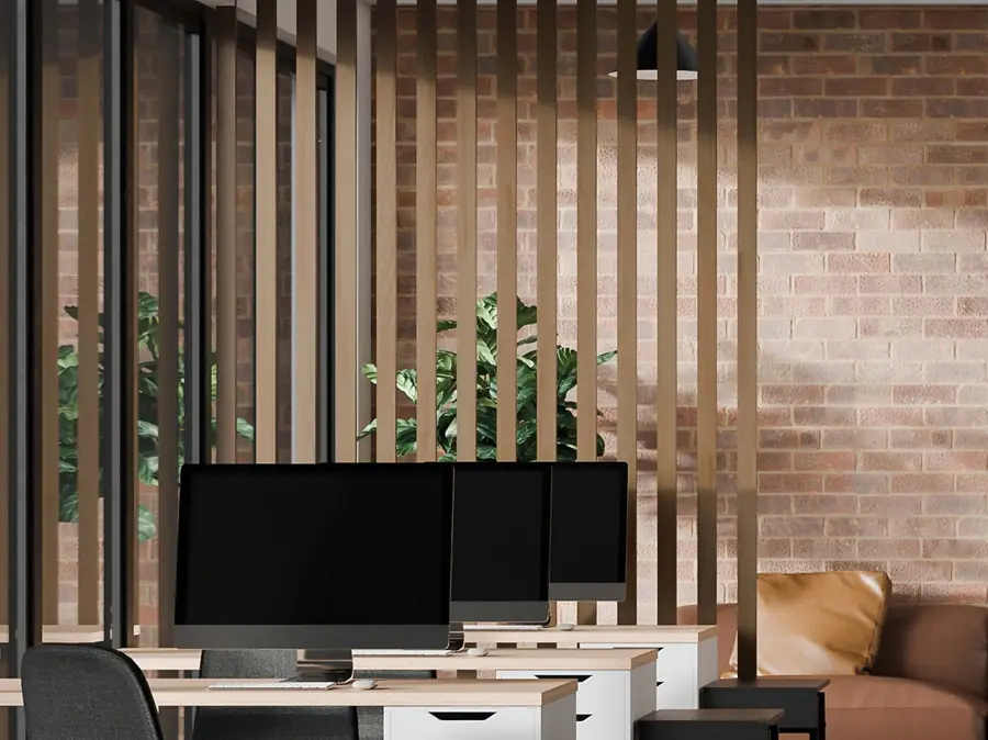 Completed interior renovation: wood-slat feature wall, workstations and lounge